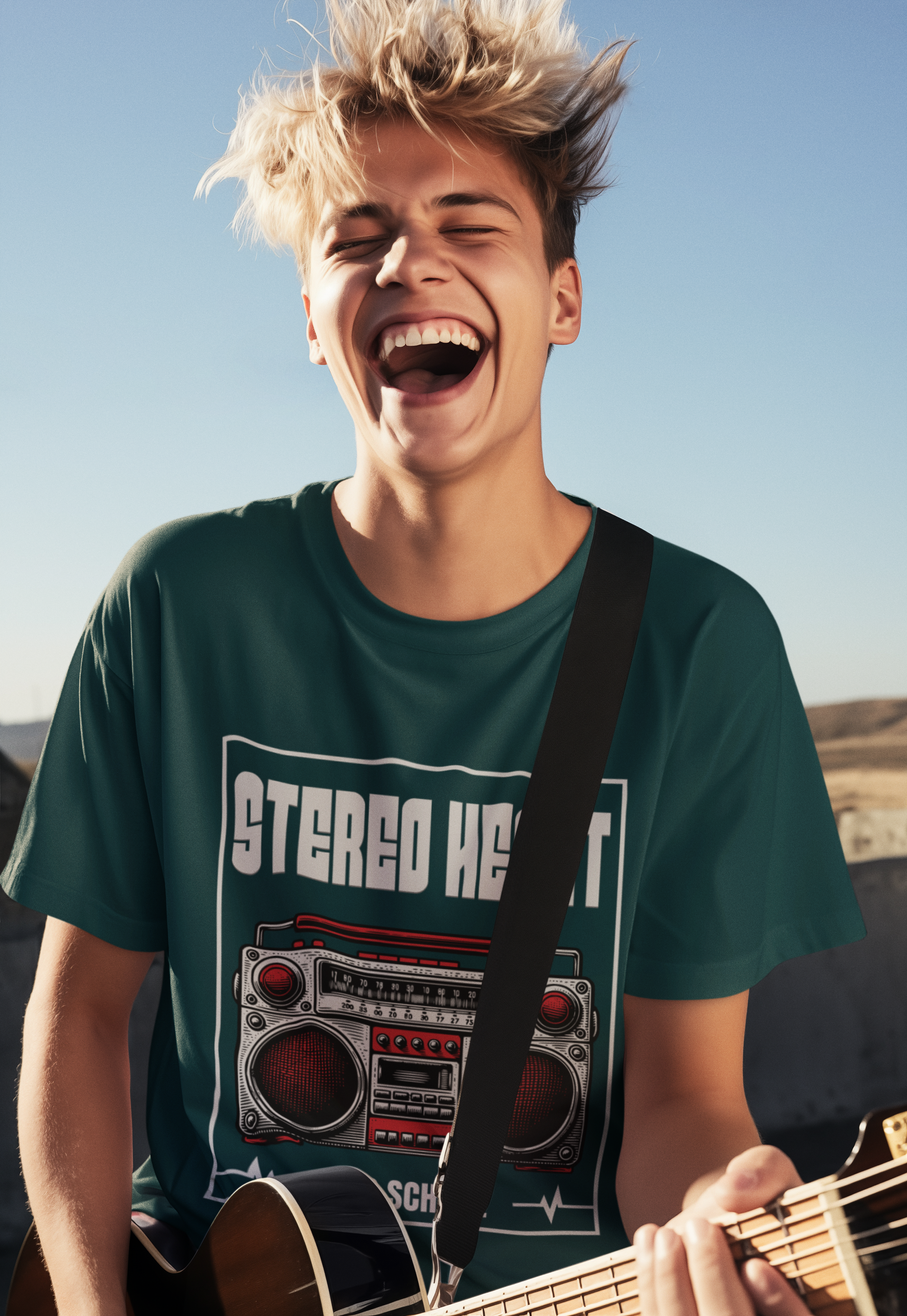 Person playing guitar with a 'Stereo Head' t-shirt against a clear sky