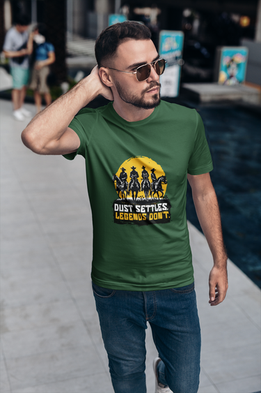 Man wearing a green t-shirt with a graphic design and text, standing on a street.